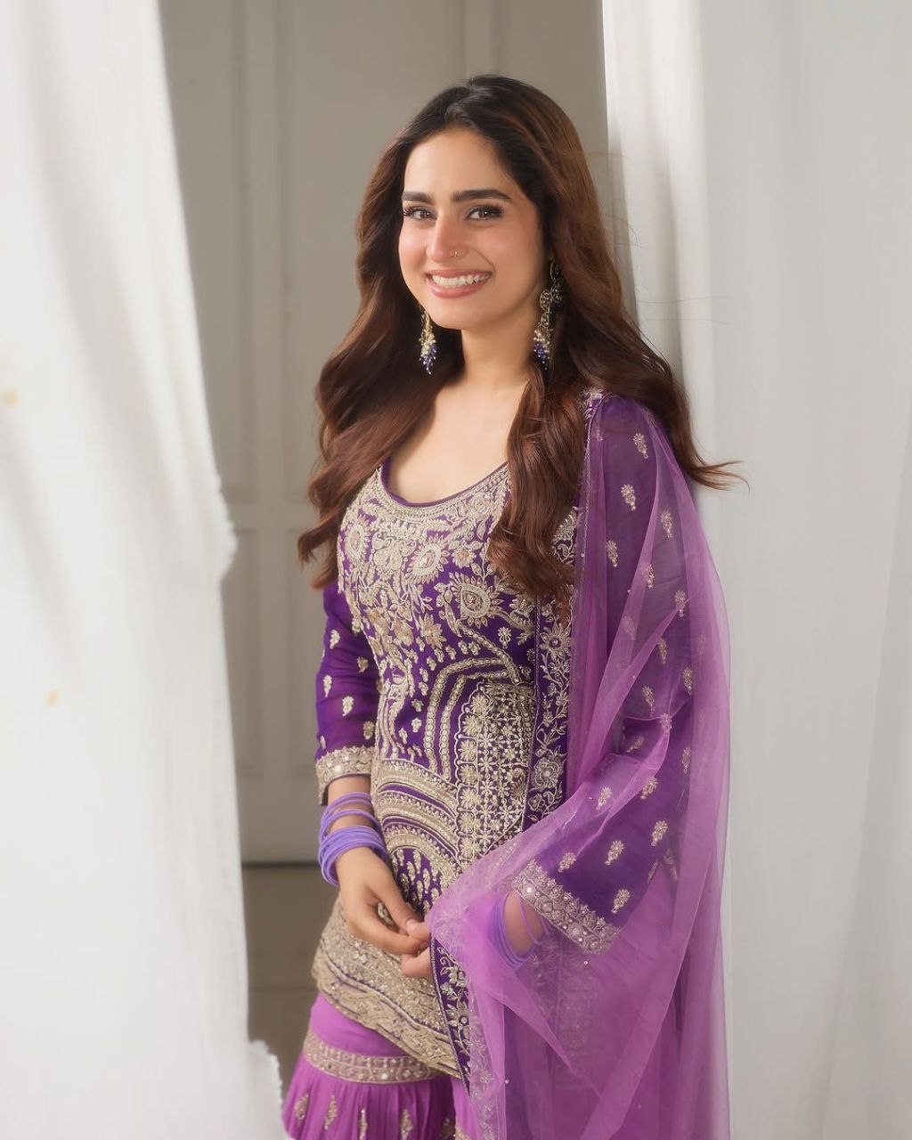 Purple Sharara Suit with Heavy Golden Embroidery & Net Dupatta